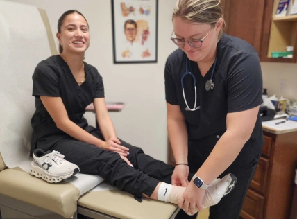 Medical assistant student learning entry-level skills